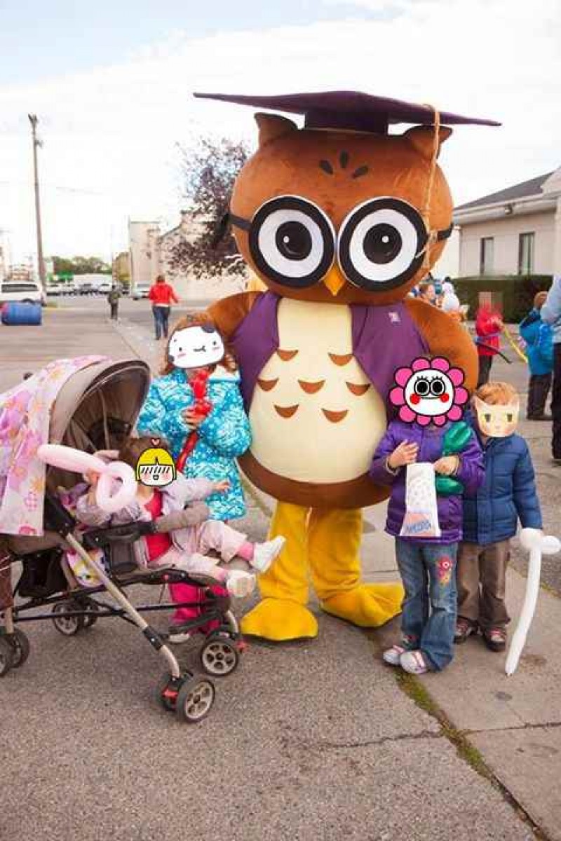 Round Brown and White Owl Mascot Costume with a Purple Graduation Cap